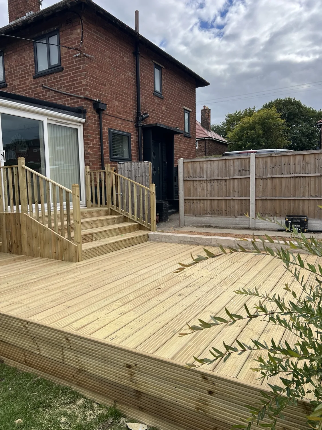 Raised garden decking with steps and balustrades